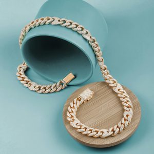 Luxurious gold and diamond-studded chain displayed artistically on a teal backdrop.